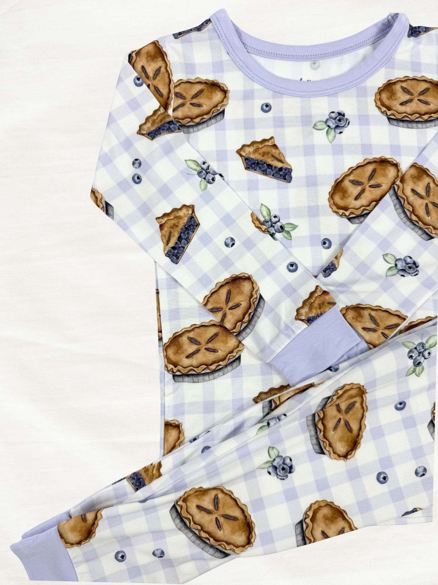 Children's pajama set with pie pattern on a  white  background