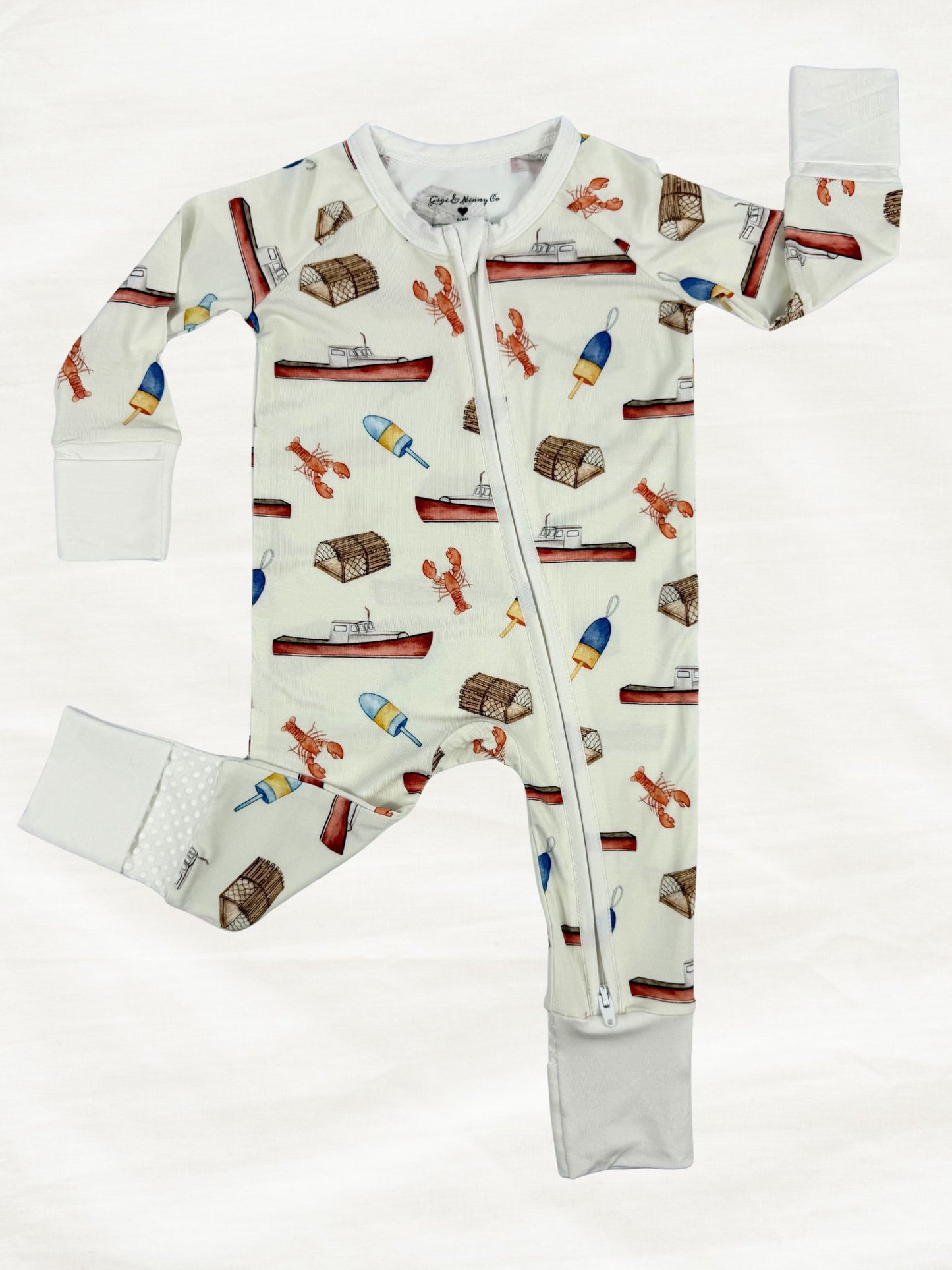 Cream baby zippy with a lobster boat print