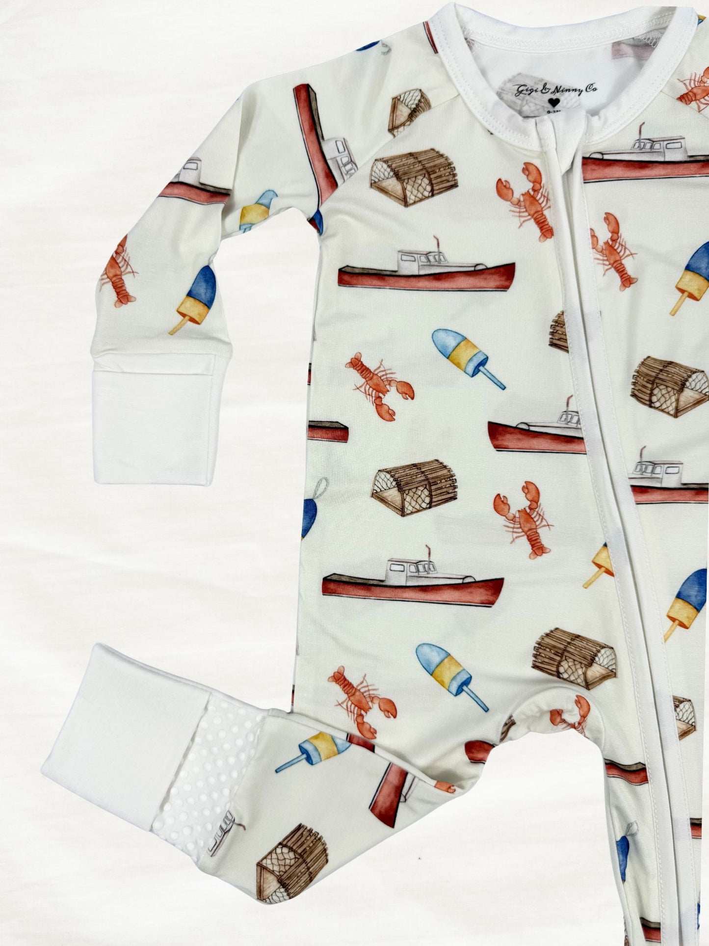 cream baby zippy with lobster boat print