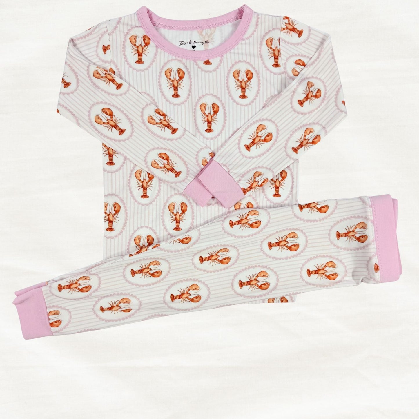 Children's pajama set with lobster pattern on a white background