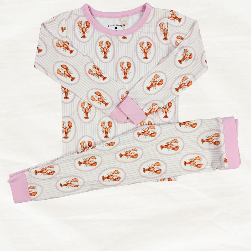 Children's pajama set with lobster pattern on a white background